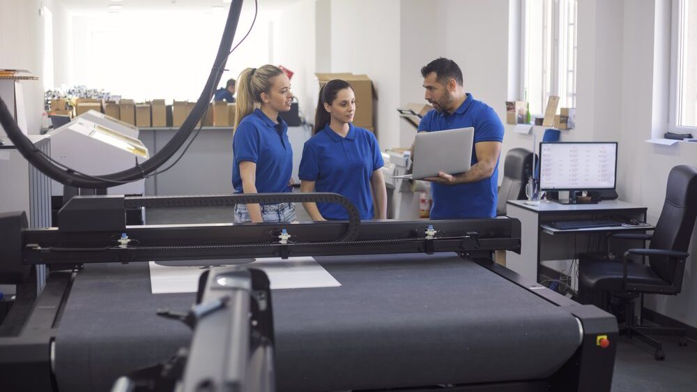 Coworkers in printing factory