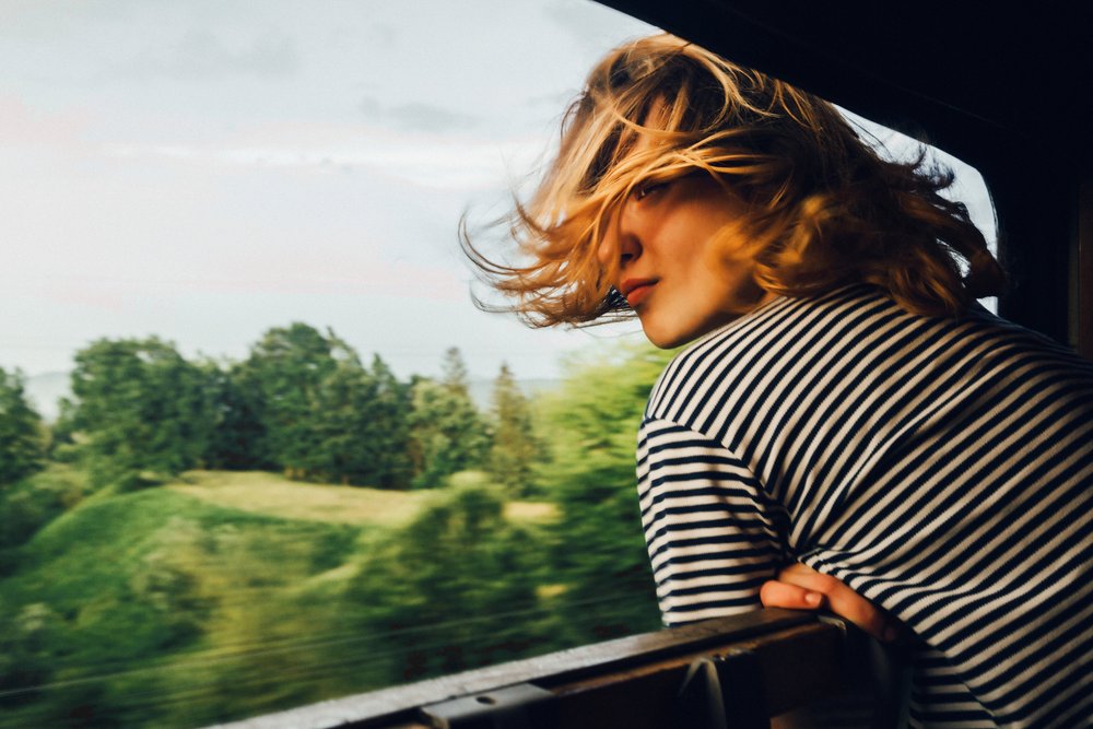 woman leaning out of train window